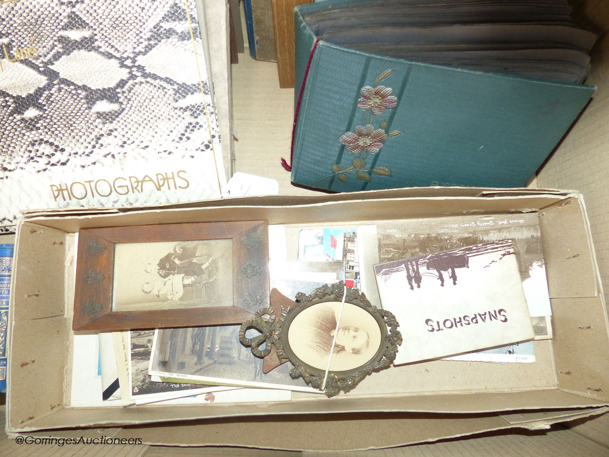 A collection of photograph albums and photos from late 19th century and two postcard albums